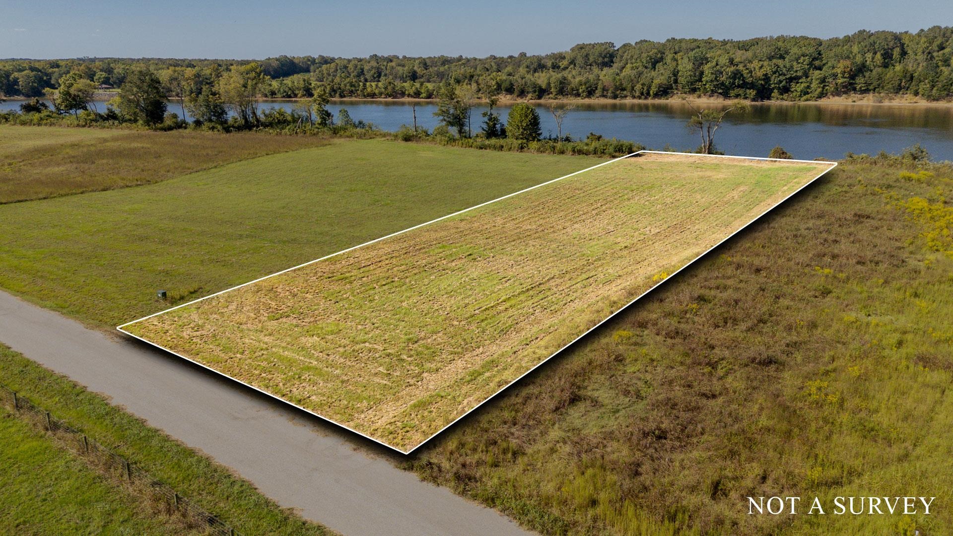 Lot 74 Cravens Road Savannah, TN 38372 - Photo 4 of 39 a view of a lake with a big yard
