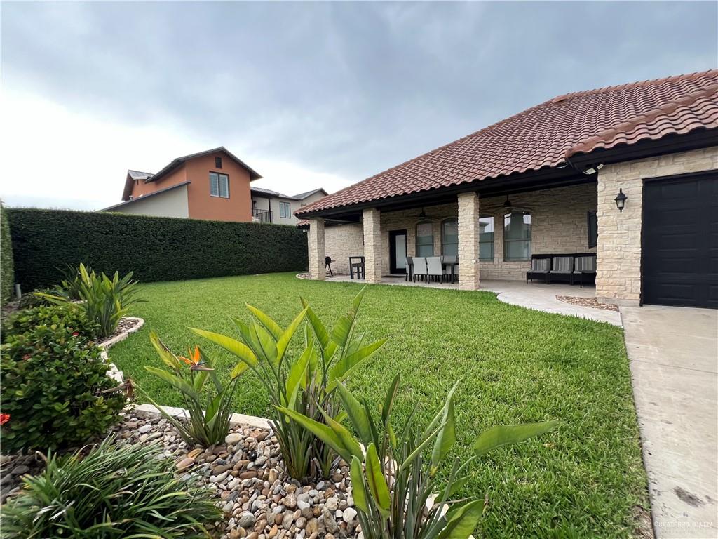 5809 North 3rd Street McAllen, TX 78504 - Photo 15 of 18 a front view of a house with garden