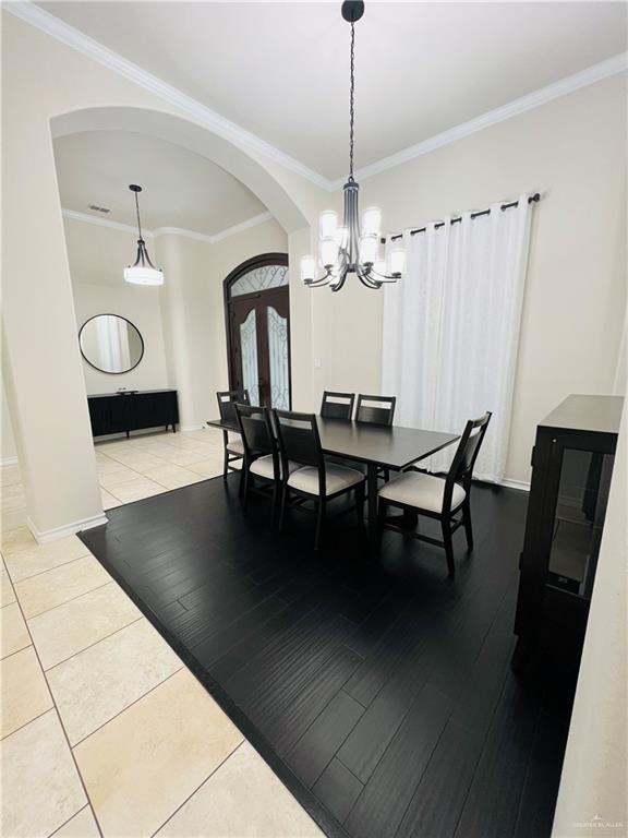 5809 North 3rd Street McAllen, TX 78504 - Photo 3 of 18 a view of a dining room with furniture and chandelier