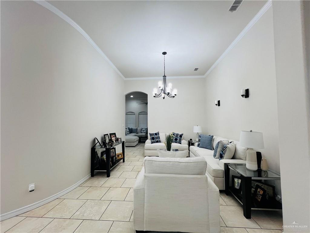 5809 North 3rd Street McAllen, TX 78504 - Photo 4 of 18 a living room with furniture a chandelier and a window