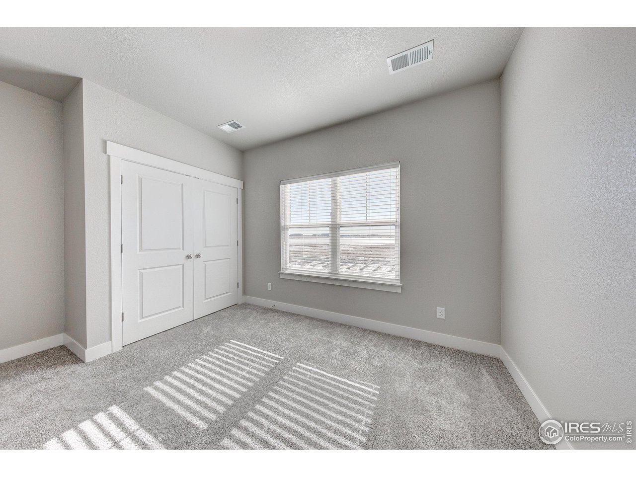 265 High Point Drive, Unit 201 Longmont, CO 80504 - Photo 16 of 26 a view of an empty room with a window