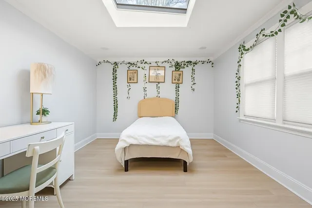 a bedroom with a bed and a table in it