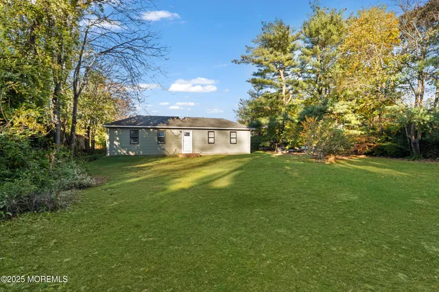 a view of a house with a big yard