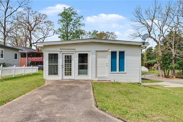 front view of a house with a yard