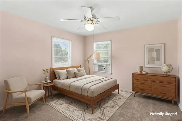 a bedroom with a bed and window