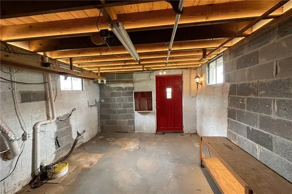 a view of empty room with wooden walls