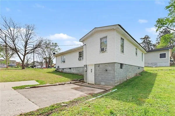 an aerial view of a house with a big yard