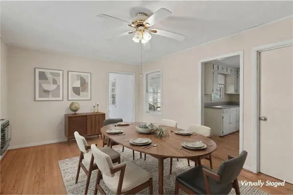 a view of a dining room with furniture and a chandelier