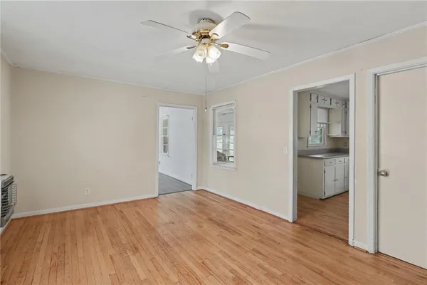 a view of an empty room with a window