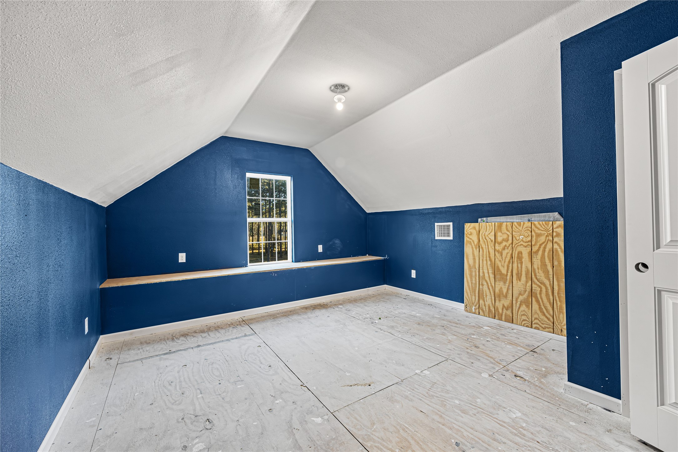 235 Bracewell Cemetery Road Livingston, TX 77351 - Photo 19 of 37 a view of an empty room with wooden floor and a window