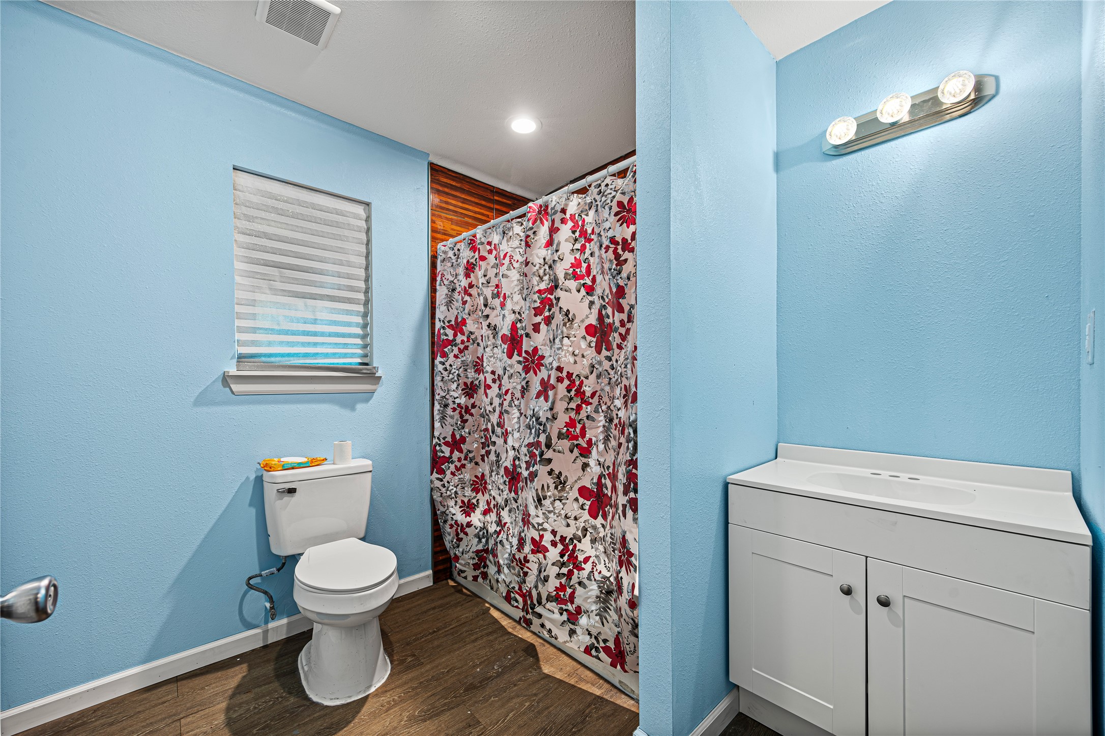 235 Bracewell Cemetery Road Livingston, TX 77351 - Photo 31 of 37 a bathroom with a toilet and a shower curtain