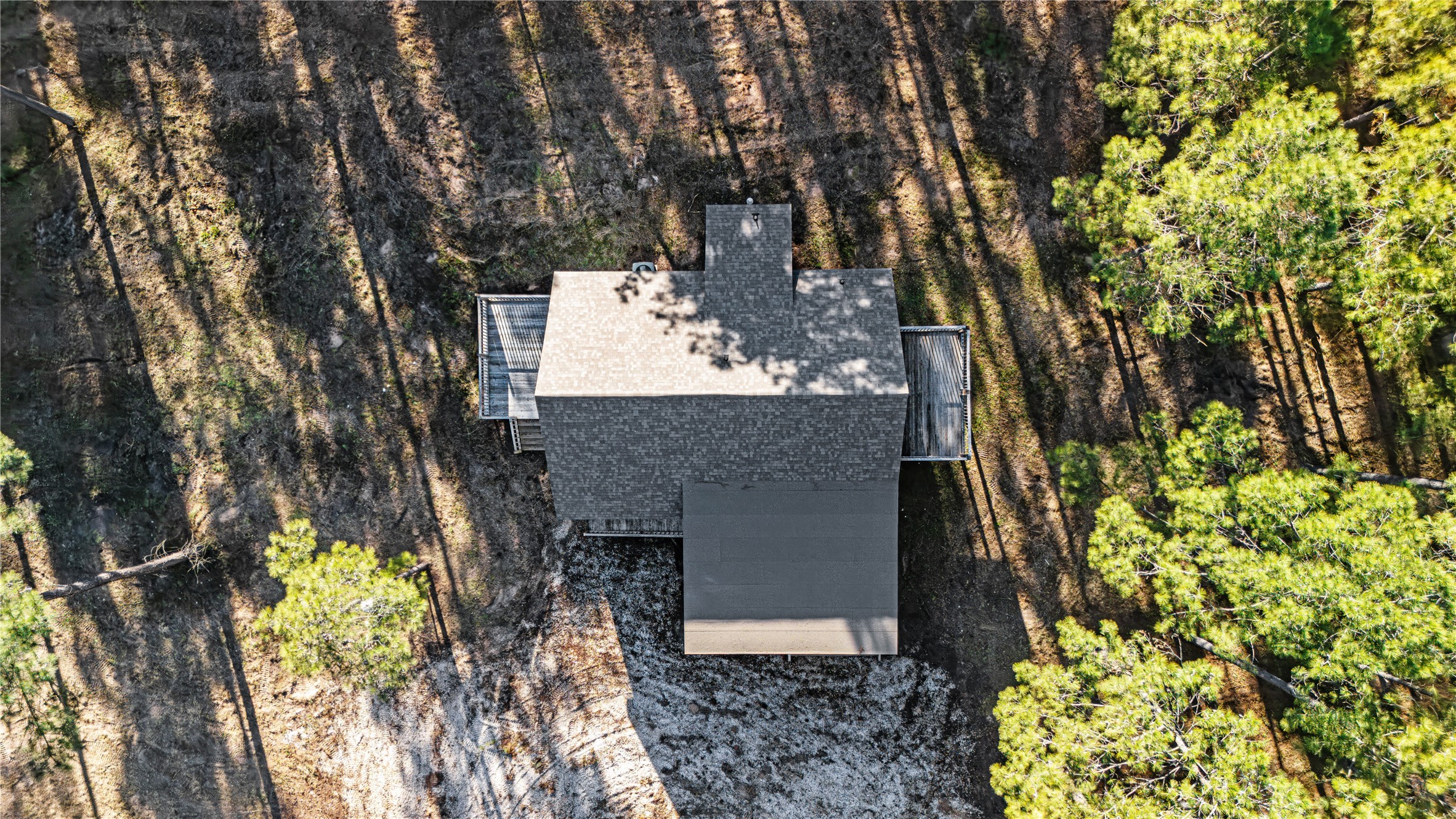 235 Bracewell Cemetery Road Livingston, TX 77351 - Photo 36 of 37 a view of a house with large trees