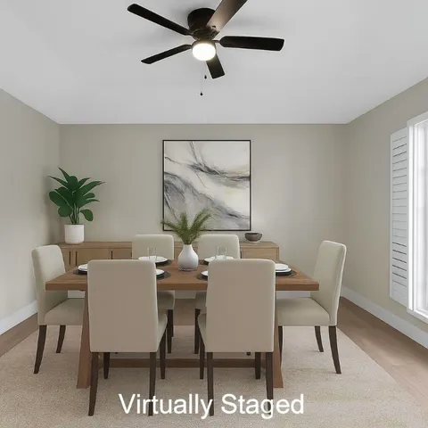 a view of a dining room with furniture and window