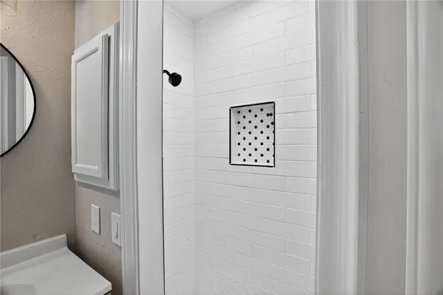 a bathroom with a bathtub and a sink