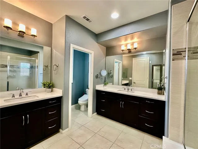 a bathroom with a sink vanity and a mirror