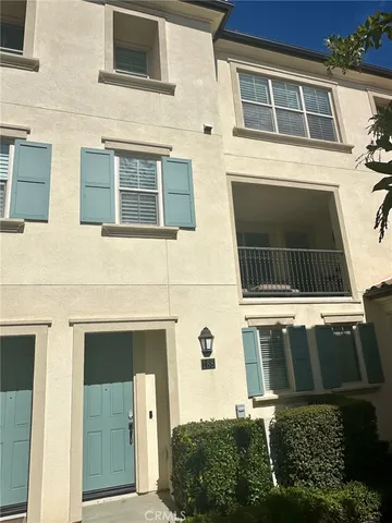 a view of front door of house with car parked
