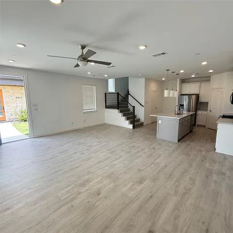 a view of a kitchen with a sink and a microwave