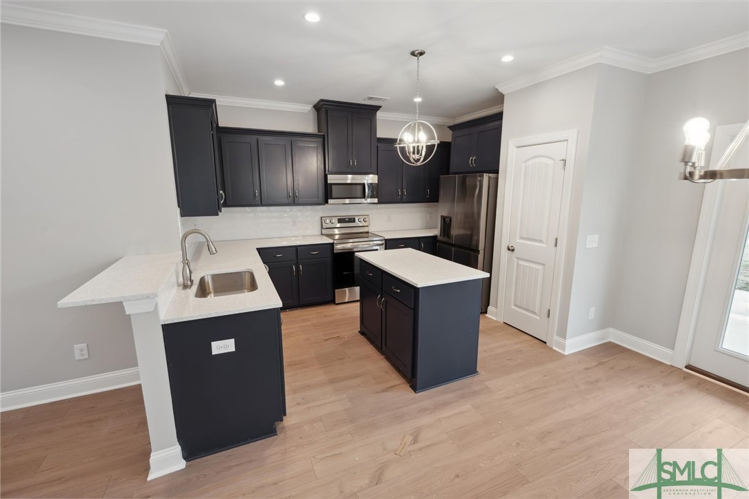 102 Owens Road Pembroke, GA 31321 - Photo 11 of 37 Stainless steel appliances and flat island.