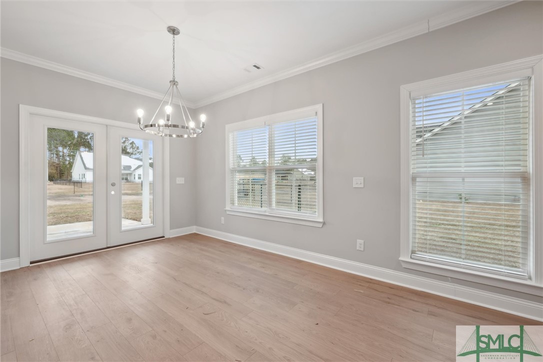 102 Owens Road Pembroke, GA 31321 - Photo 12 of 37 Dining area with doors opening to the patio and ba