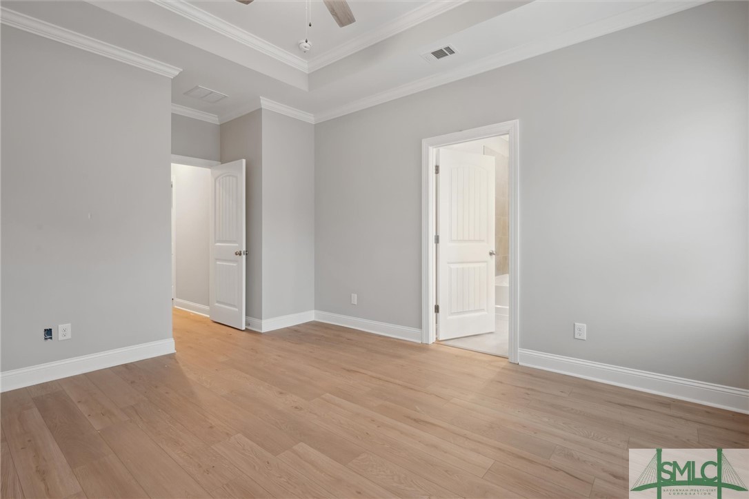 102 Owens Road Pembroke, GA 31321 - Photo 16 of 37 Tray ceiling with lighted fan.