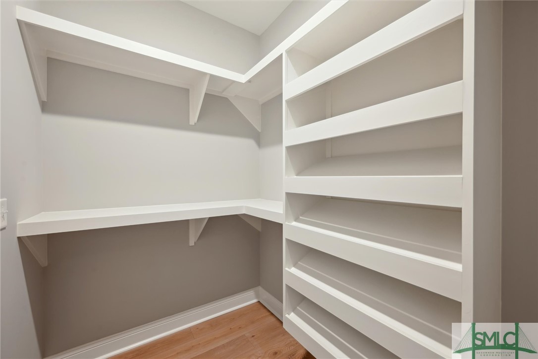102 Owens Road Pembroke, GA 31321 - Photo 22 of 37 Custom built wood shelving in primary walk-in clos