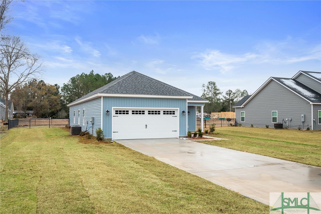 102 Owens Road Pembroke, GA 31321 - Photo 34 of 37 Attached garage and very low maintenance living.