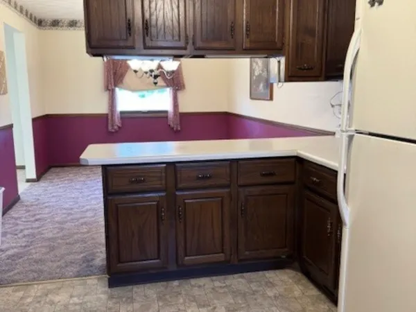 a kitchen with a sink and a refrigerator