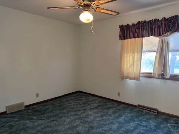a kitchen with a sink and a toilet
