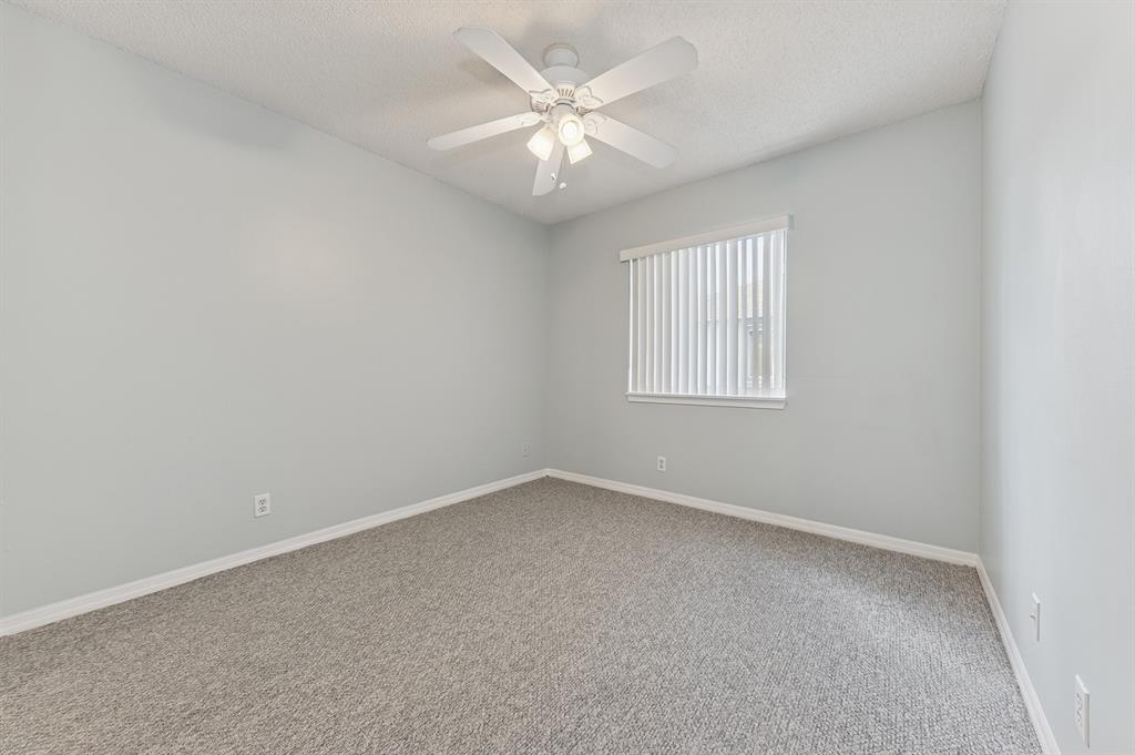 6007 Red Plum Court, Unit 465 Tamarac, FL 33321 - Photo 14 of 23 an empty room with windows and chandelier fan