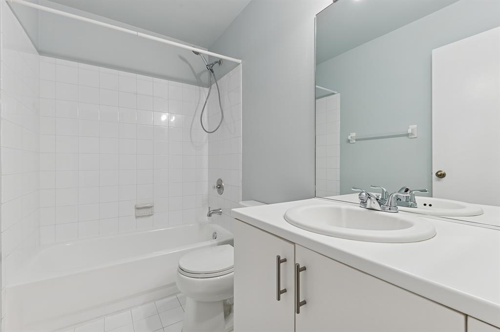 6007 Red Plum Court, Unit 465 Tamarac, FL 33321 - Photo 15 of 23 a bathroom with a sink a toilet and shower
