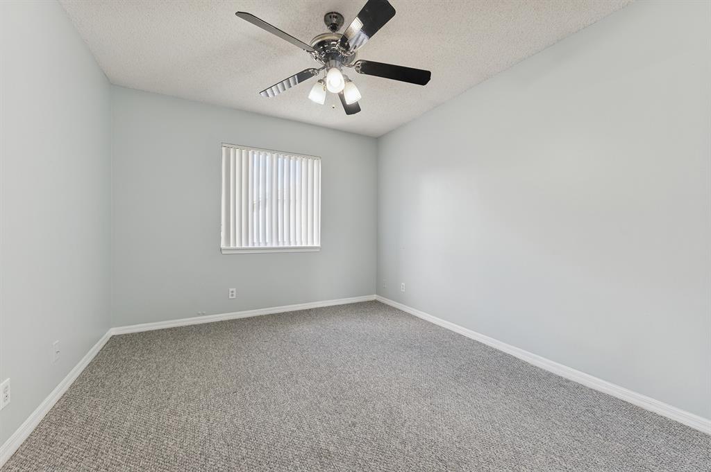 6007 Red Plum Court, Unit 465 Tamarac, FL 33321 - Photo 16 of 23 an empty room with a window and a fan