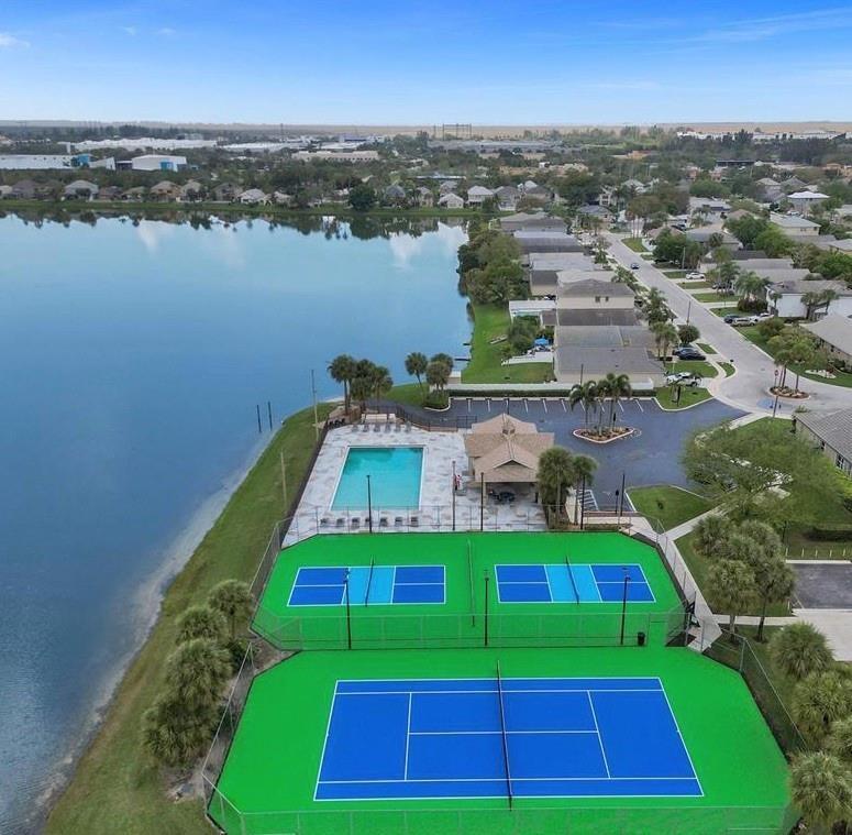 6007 Red Plum Court, Unit 465 Tamarac, FL 33321 - Photo 20 of 23 an aerial view of a house with a yard and lake view