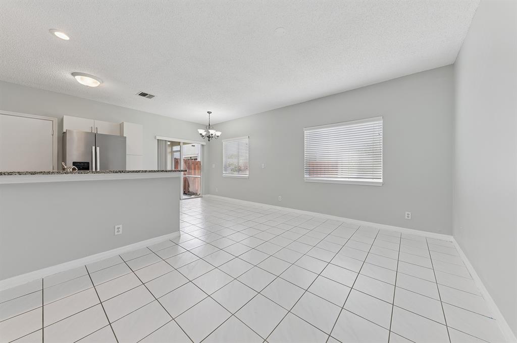 6007 Red Plum Court, Unit 465 Tamarac, FL 33321 - Photo 6 of 23 a view of a kitchen with a sink and a window