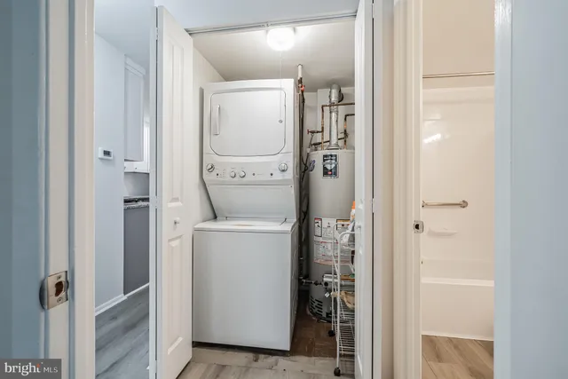 a bathroom with a glass door shower and a sink