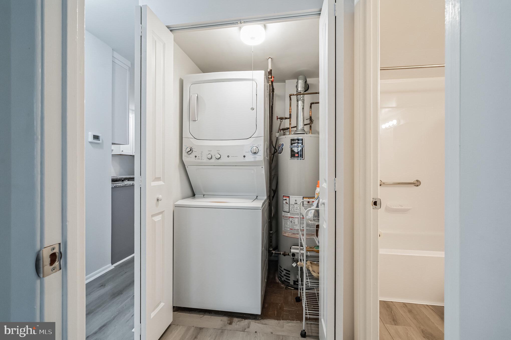 611-15 Roxborough Avenue, Unit 607A Philadelphia, PA 19128 - Photo 11 of 16 a bathroom with a glass door shower and a sink