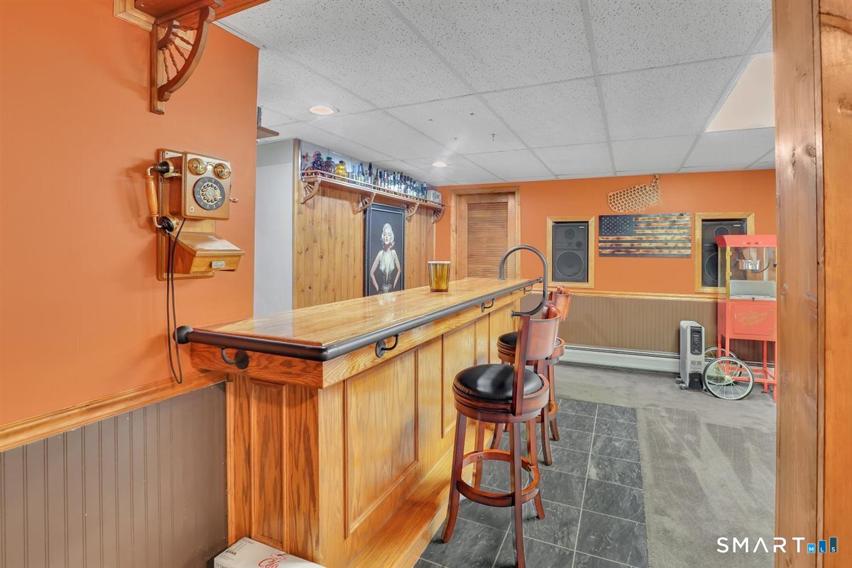 122 Antrim Road Coventry, CT 06238 - Photo 28 of 40 Fully finished lower level complete with bar!!