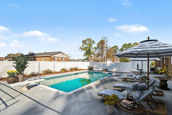 a view of yard with large trees