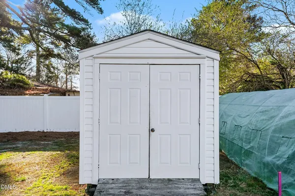 a white house with a small yard