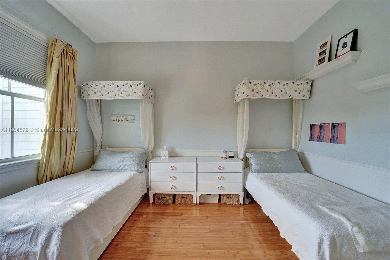 290 Ridgewood Road Key Biscayne, FL 33149 - Photo 35 of 51 a bedroom with furniture and a large window