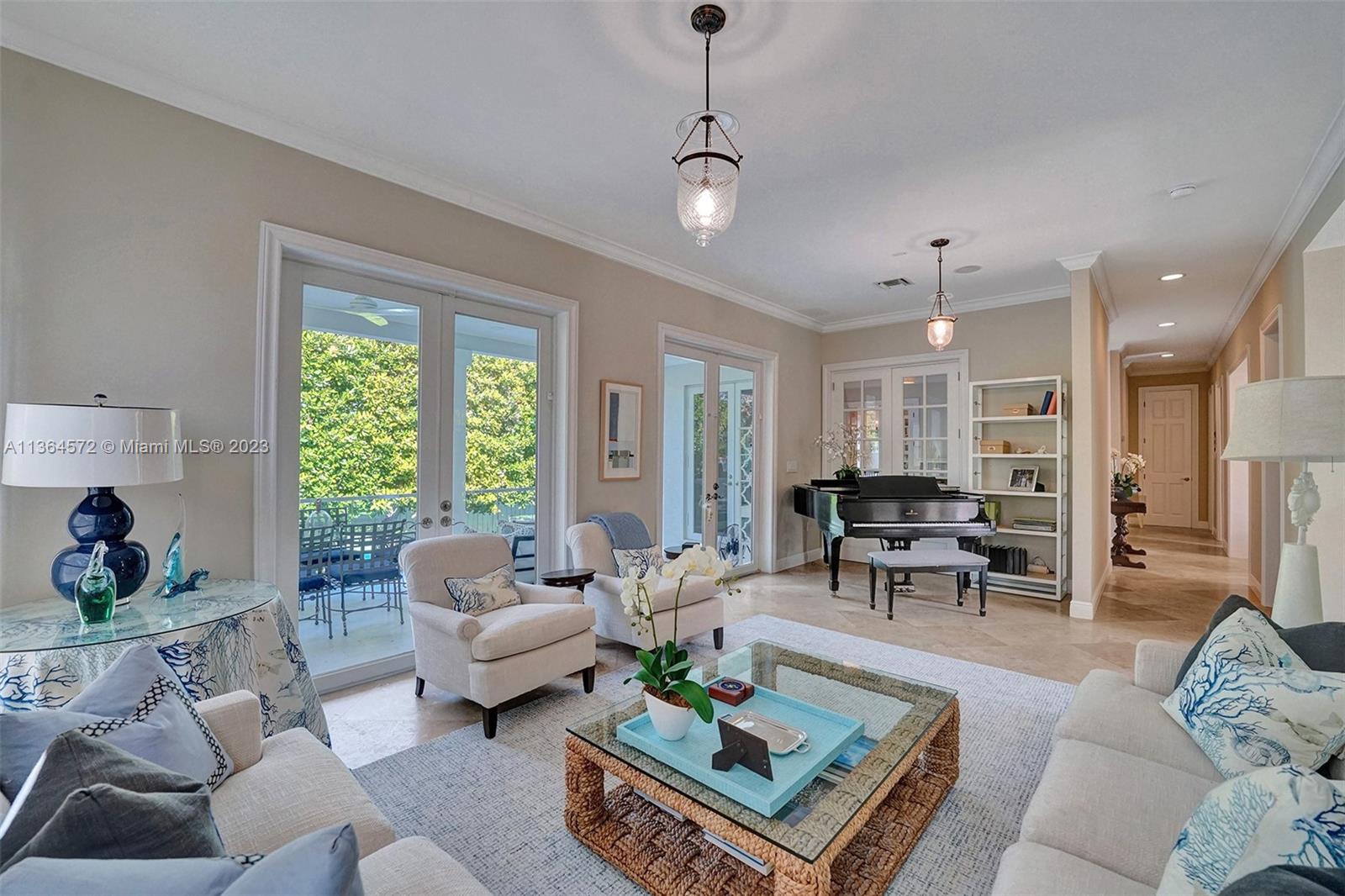 290 Ridgewood Road Key Biscayne, FL 33149 - Photo 8 of 51 a living room with furniture and a large window
