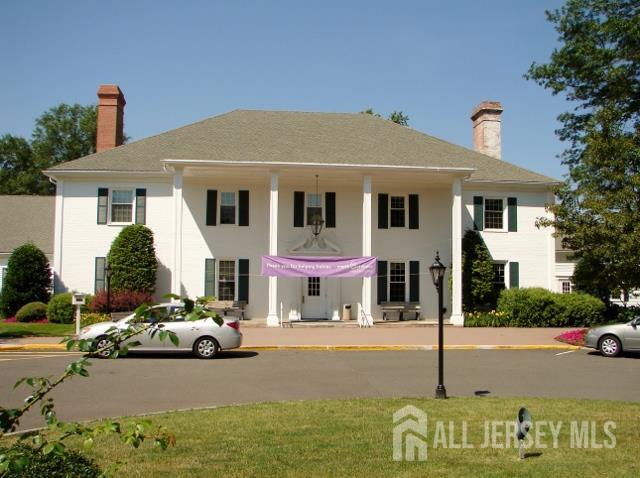 337A Old Nassau Road, Unit A Monroe Township, NJ 08831 - Photo 31 of 39 a front view of a house with garden