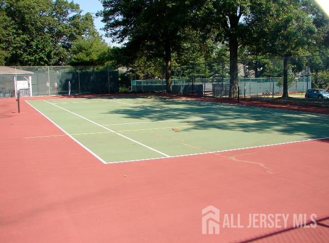 337A Old Nassau Road, Unit A Monroe Township, NJ 08831 - Photo 35 of 39 a view of a tennis ground with large trees