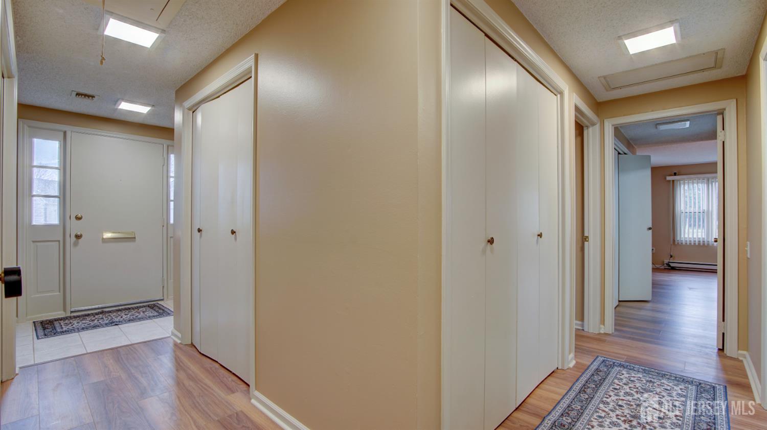337A Old Nassau Road, Unit A Monroe Township, NJ 08831 - Photo 4 of 39 a view of a hallway with wooden floor