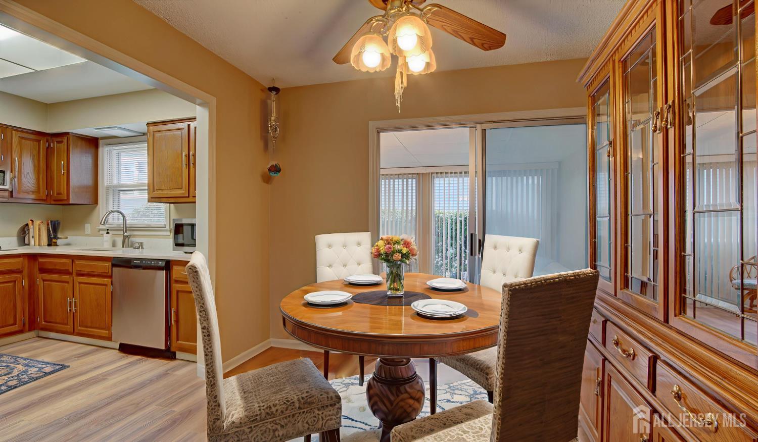 337A Old Nassau Road, Unit A Monroe Township, NJ 08831 - Photo 8 of 39 a view of a dining room with furniture and wooden floor