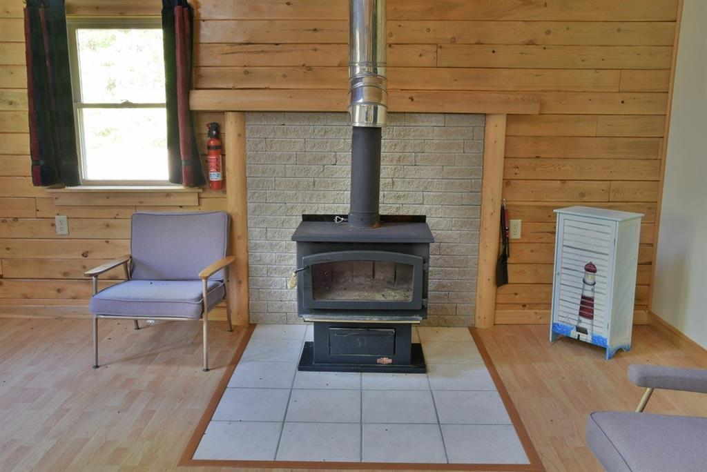 635 State Road Mapleton, ME 04757 - Photo 7 of 35 Wood Stove in the Living Room