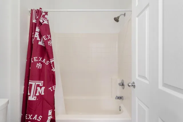 a view of a swimming pool with a patio and a yard