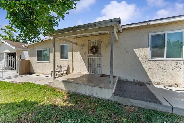 a view of a house with sitting area and furniture