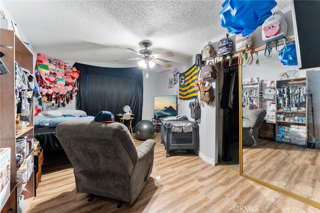 491 East C Street Colton, CA 92324 - Photo 20 of 58 a bed room with a bed and a chair