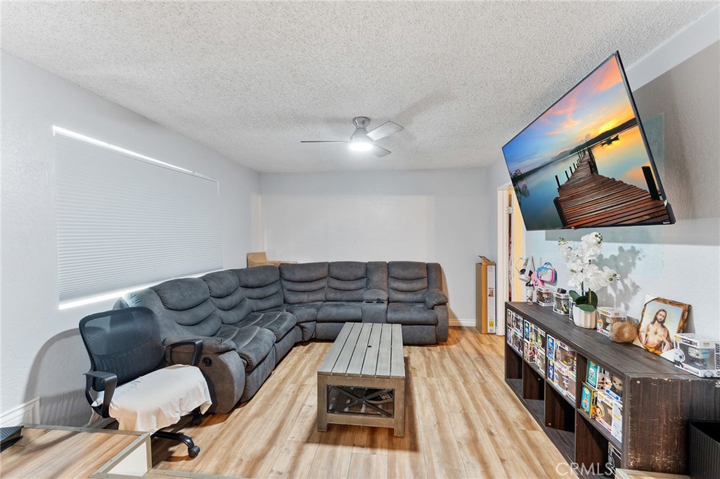 491 East C Street Colton, CA 92324 - Photo 22 of 58 a living room with furniture and wooden floor
