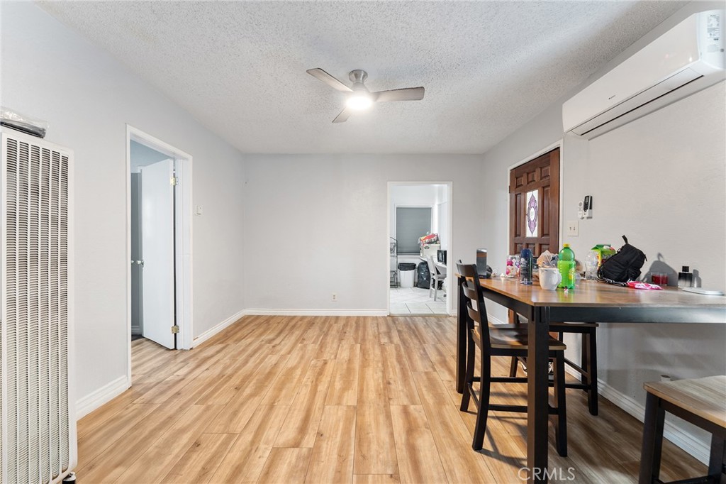 491 East C Street Colton, CA 92324 - Photo 27 of 58 a view of a dining room with furniture and wooden floor